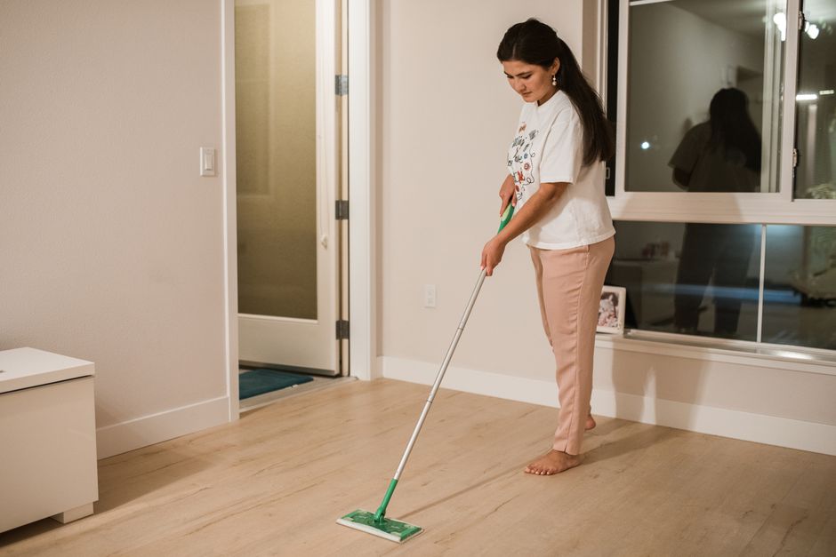 Mopping hardwood floors for recurring cleaning maintenance